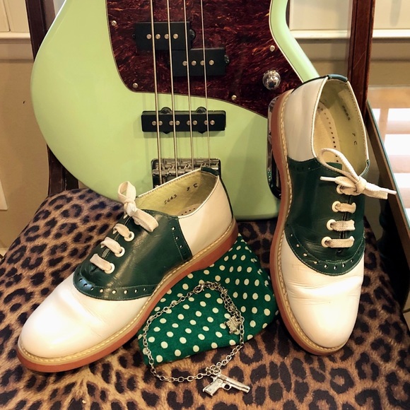 green and white saddle shoes